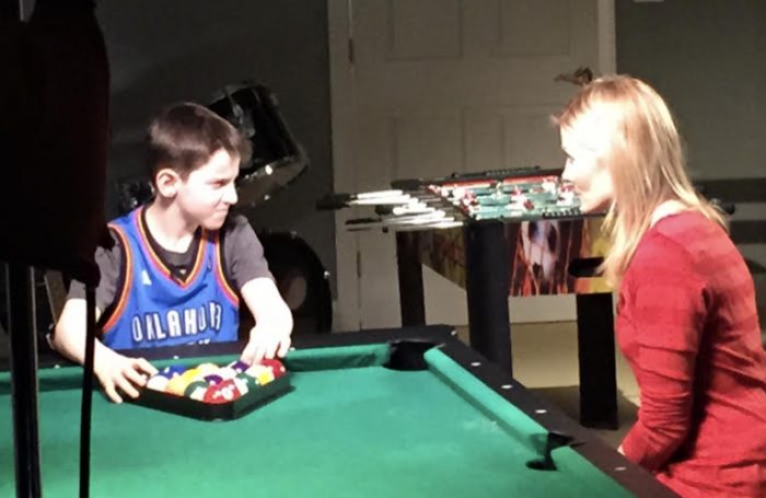 spring | Porphyria News | NBC's Kate Snow sits and talks with a 10-year-old Brady while he racks balls on a pool table. 