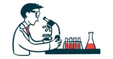 A scientist studies samples using a microscope in a lab.