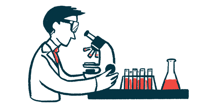 A scientist studies samples using a microscope in a lab.