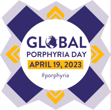 This logo has a white circle with the words "Global Porphyria Day," "April 19, 2023," and "#porphyria." Dark purple bars extend from the circle at four corners. In between there are doubled arrow marks in yellow. The entire logo is in a shaped, light purple background.