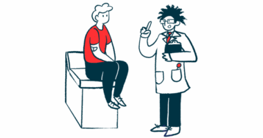 A man sits on an examining table as he listens to his doctor.