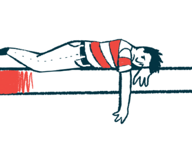 A person who looks upset and dejected lays on a mattress.