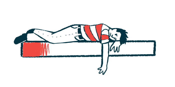 A person who looks upset and dejected lays on a mattress.