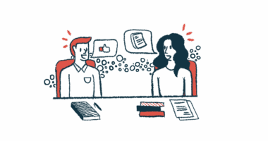 In this illustration of collaboration, two people sit at a desk covered by books and papers while discussing ideas.